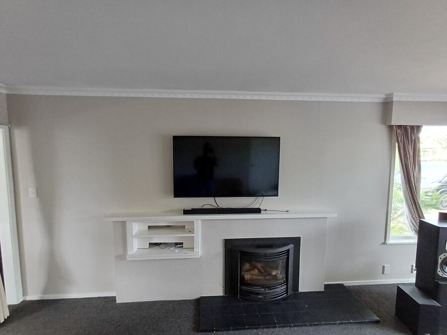 Wall-mounted TV and entertainment install in a Hamilton lounge